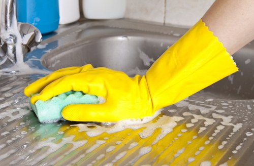 Operator using carpet cleaning equipment with electrical safety precautions