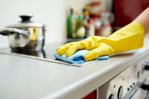 Kitchen surfaces being cleaned in a Waterloo property before new occupants arrive